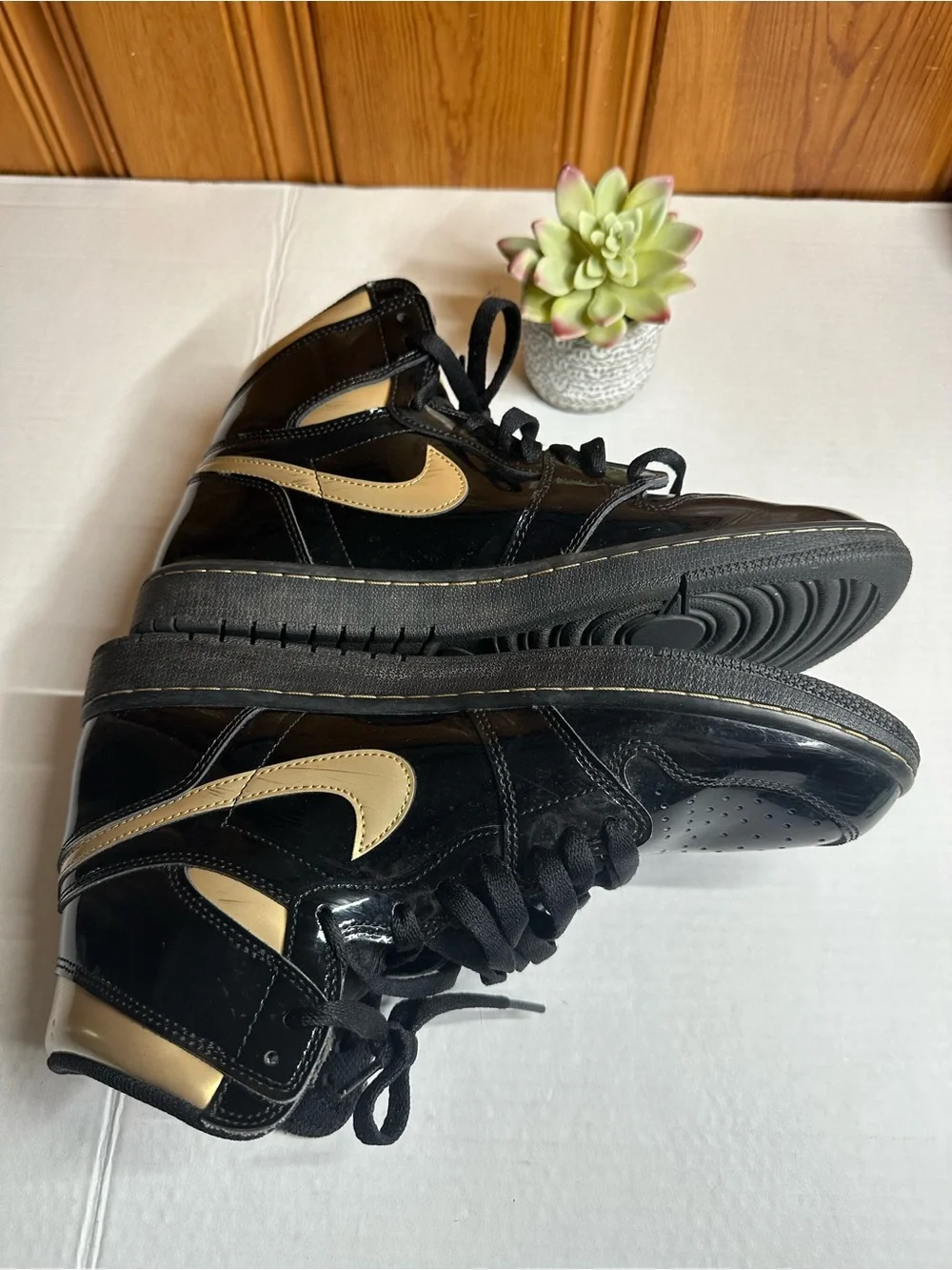 Nike Air High-Top Sneakers in Black with Gold Logo